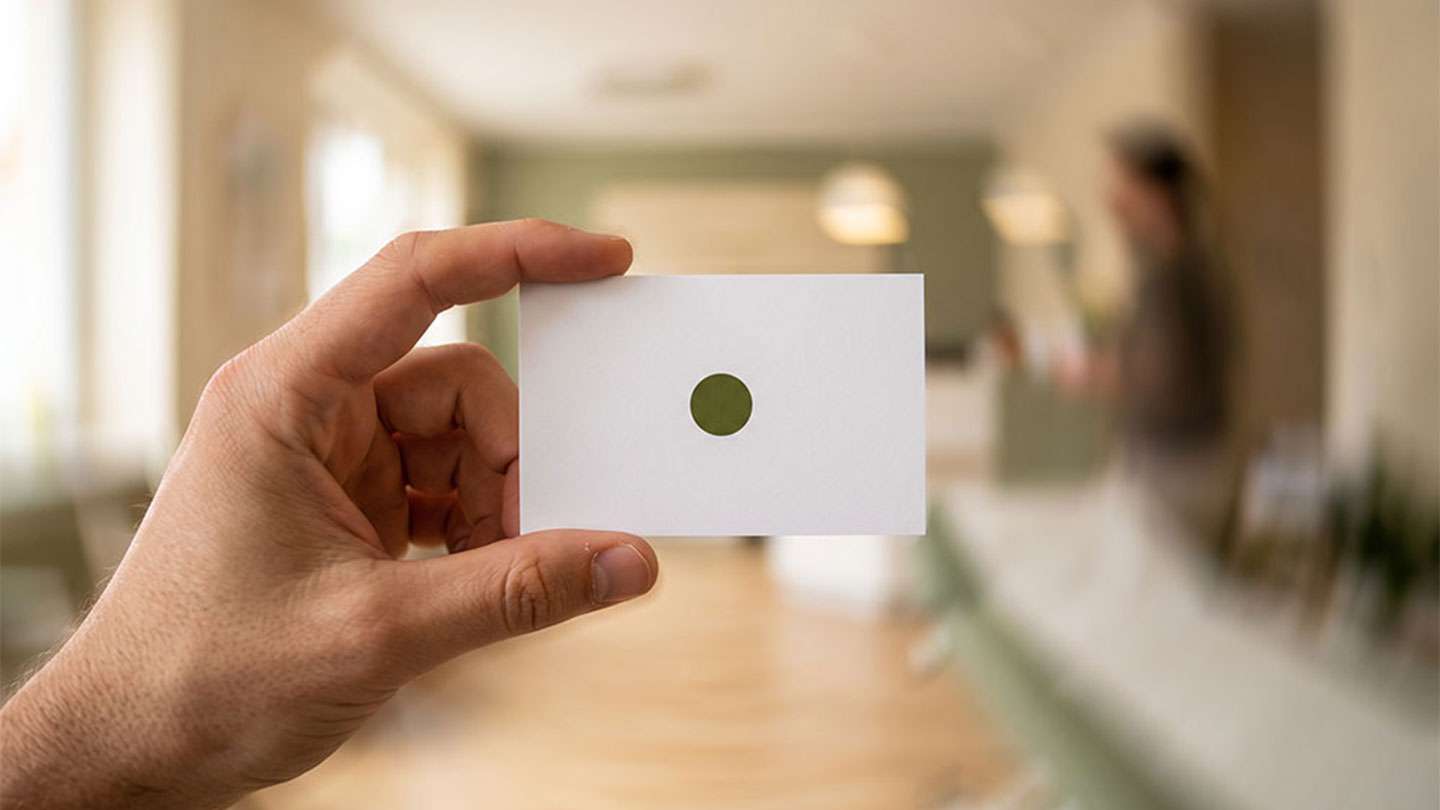 Fixation target held steady while the room blurs behind it during vestibular gaze training
